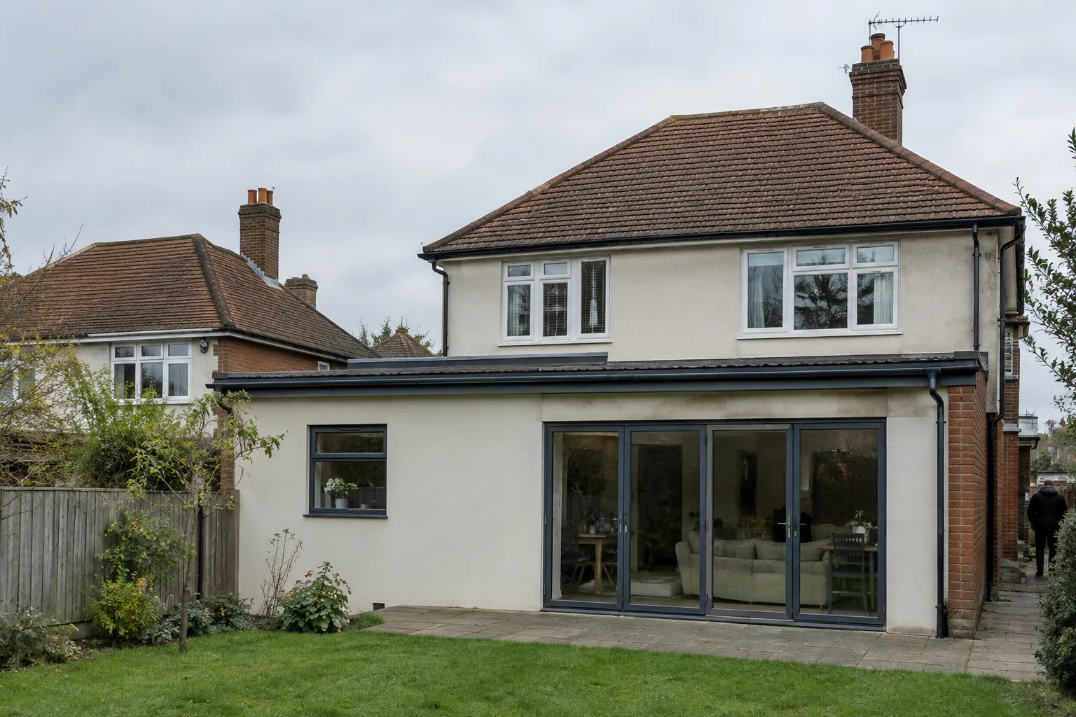 A house roof with both a pitched section and a flat extension roof